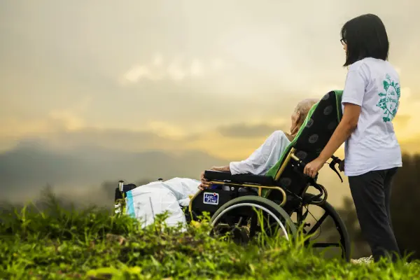 Patient outside with carer
